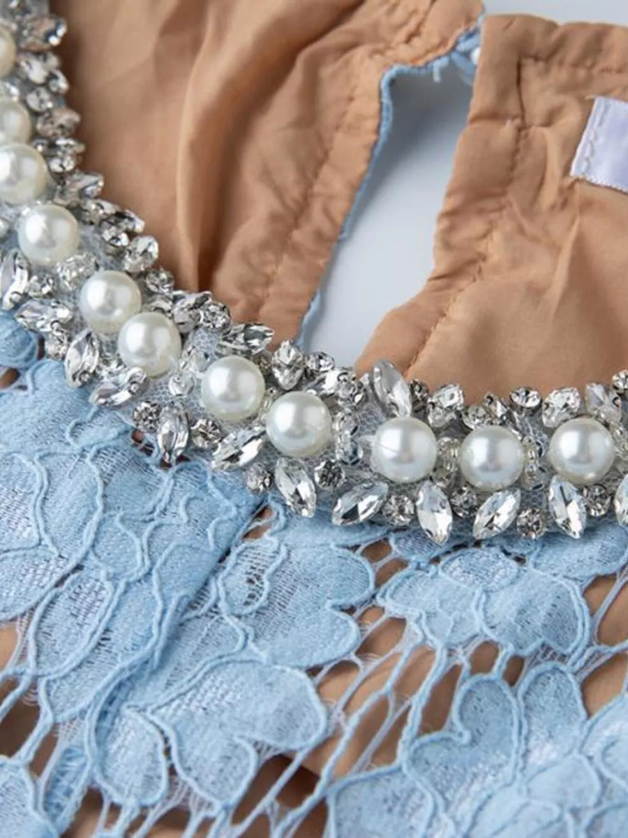 Blue lace dress with pearl and crystal embellished neckline detail