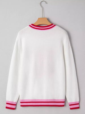 White round-neck sweater with striped ribbed collar, cuffs, and hem in pink and red.