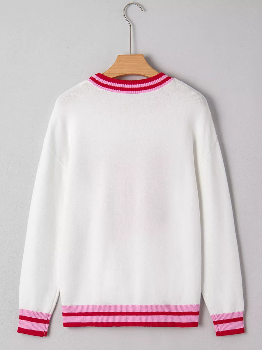 White round-neck sweater with striped ribbed collar, cuffs, and hem in pink and red.