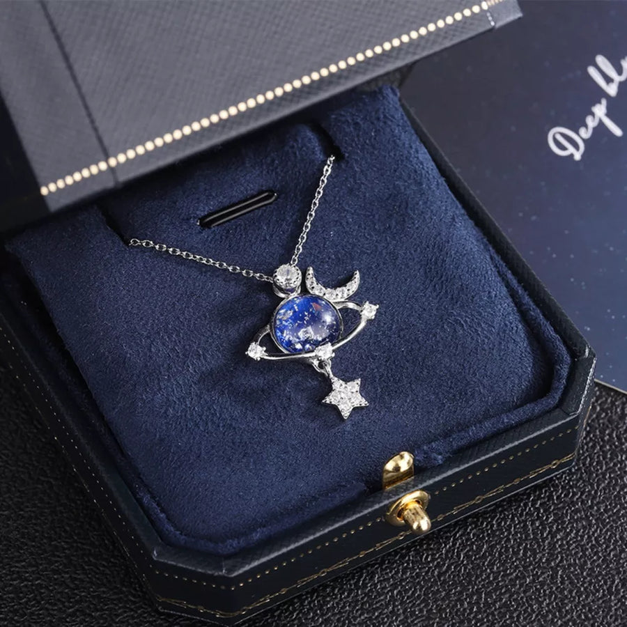 necklace in Silver with celestial motif and planet pendant