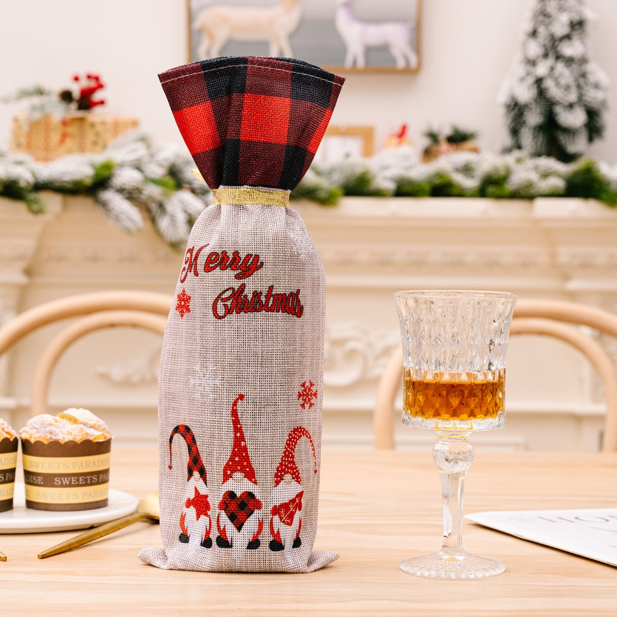 Festive gnome plaid bottle cover with Merry Christmas text and buffalo plaid top.