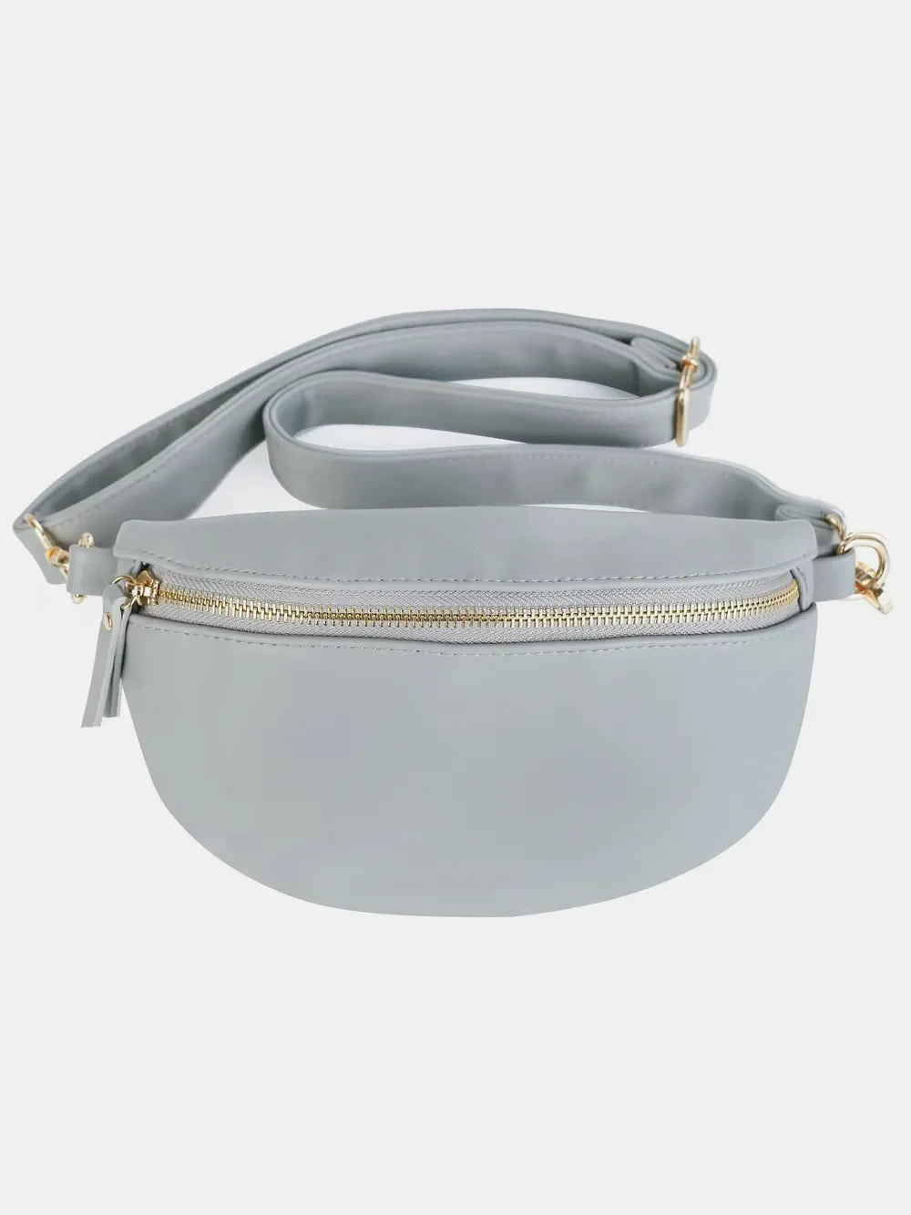 Light gray faux leather curved zip belt bag with gold hardware and adjustable strap.