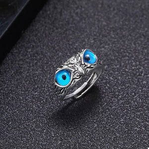 silver ring with blue eyes and na