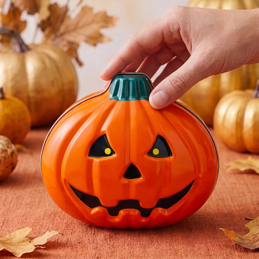 storage box in orange with jack-o'-lantern motif and pumpkin shape