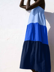 Three-tone wide strap dress with tiered skirt in light blue, royal blue, and navy.