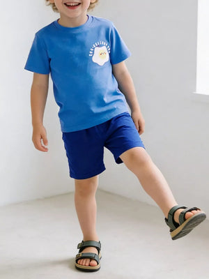 Blue cotton blend toddler t-shirt and shorts set with sunny-side up egg graphic.