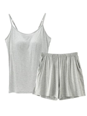 Light gray cami and shorts pajama set with adjustable straps and pockets.