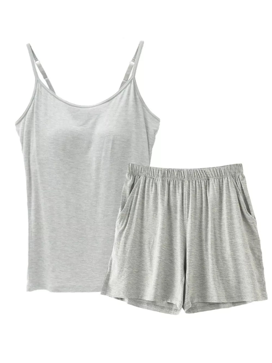 Light gray cami and shorts pajama set with adjustable straps and pockets.