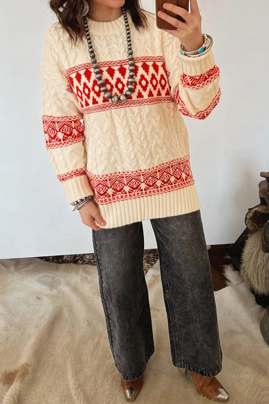 red pullover sweater featuring cable knit and geometric