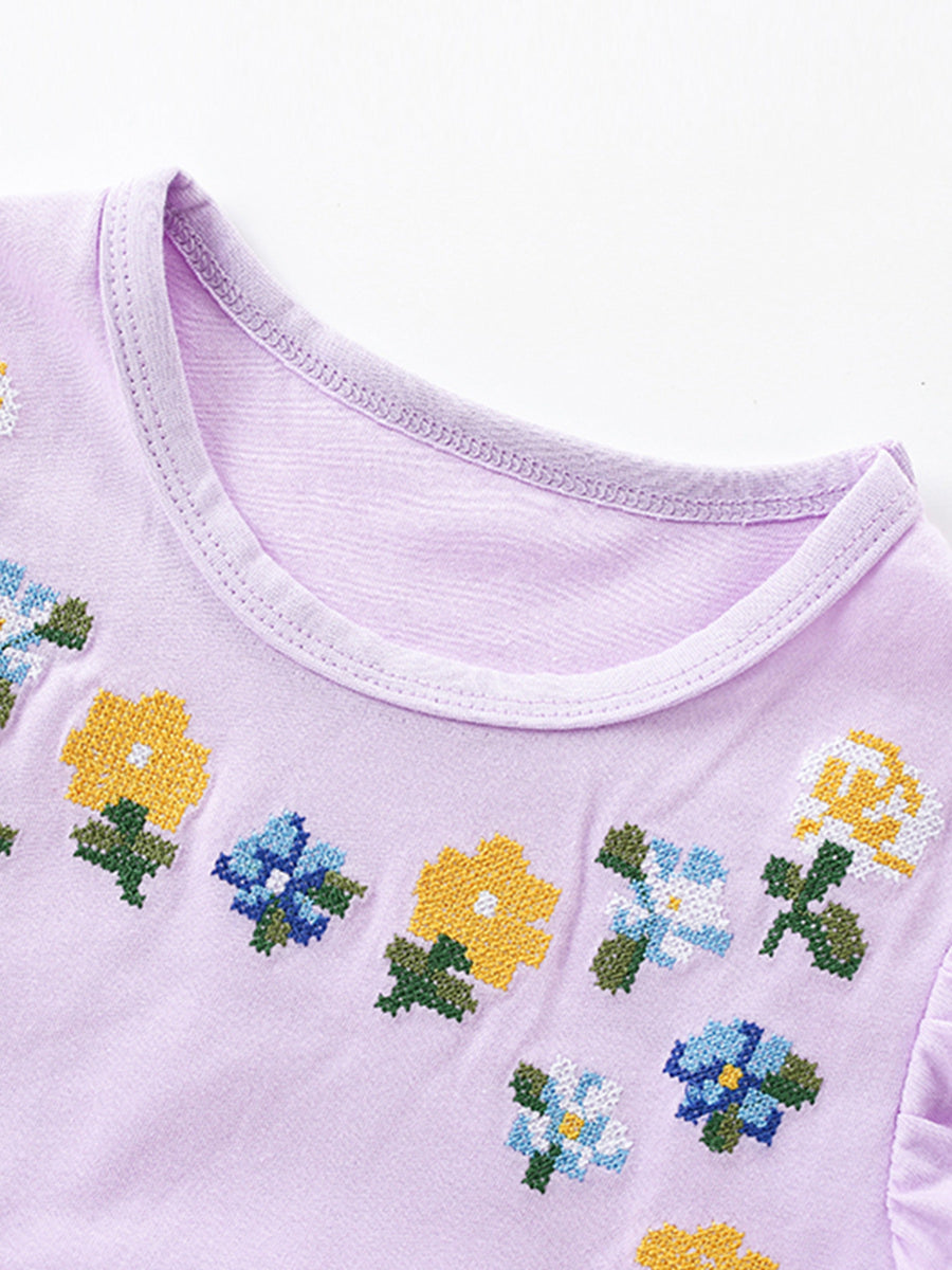 Lavender toddler dress with floral embroidery and crew neck.