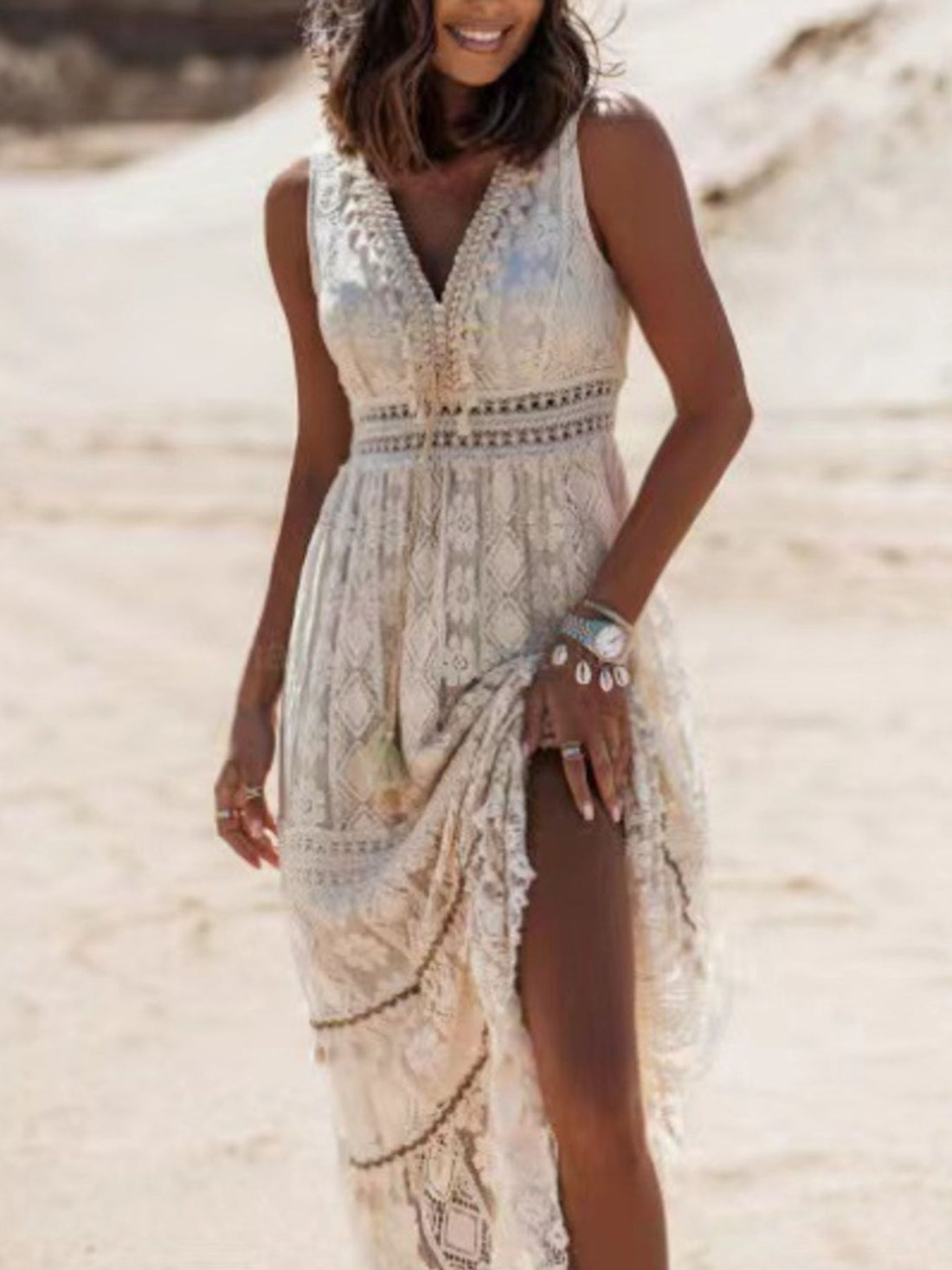 Lace V-neck maxi dress in white with crochet details and a high slit.