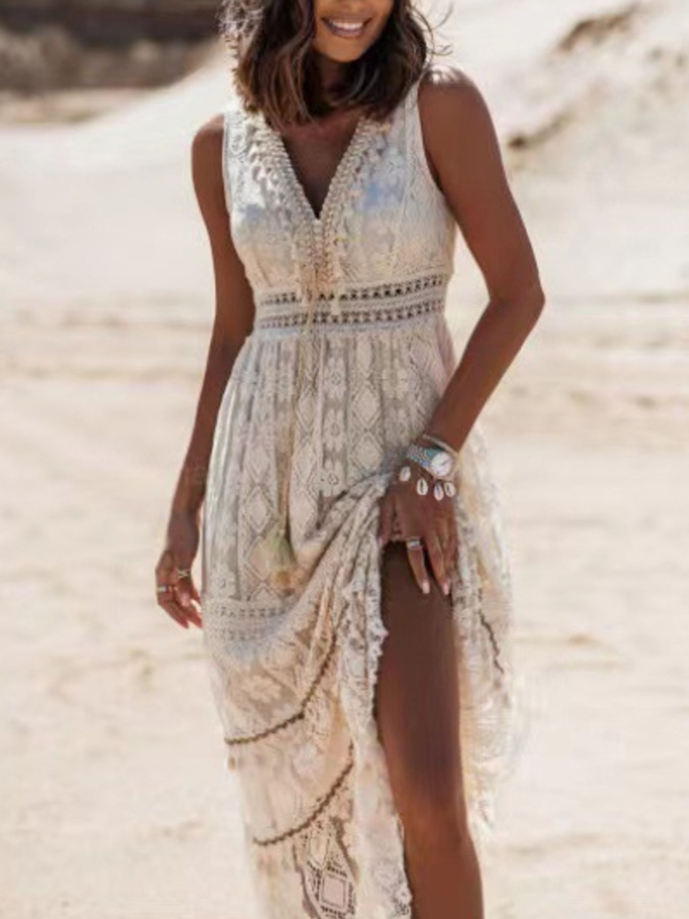 Lace V-neck maxi dress in white with crochet details and a high slit.