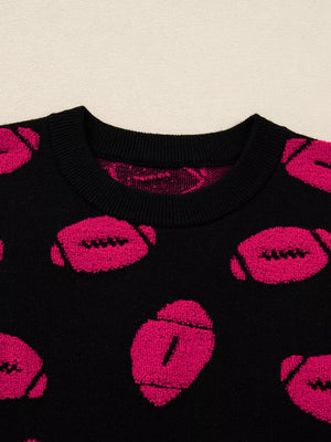 Black knit sweater with a playful pink football pattern and crew neck.