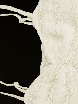 White textured sweetheart neck cami top with lace trim and tie straps.
