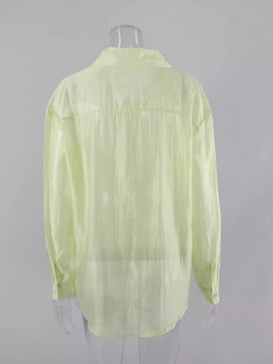light green button-up shirt with button cuffs and long sleeve