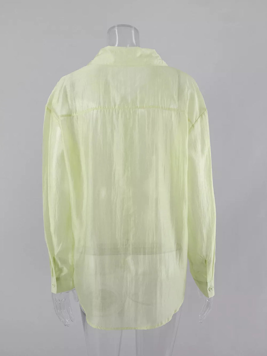 light green button-up shirt with button cuffs and long sleeve
