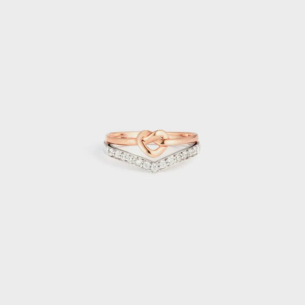 Knot & Chevron Zircon Ring Stack in silver and rose gold with cubic zirconia accents.