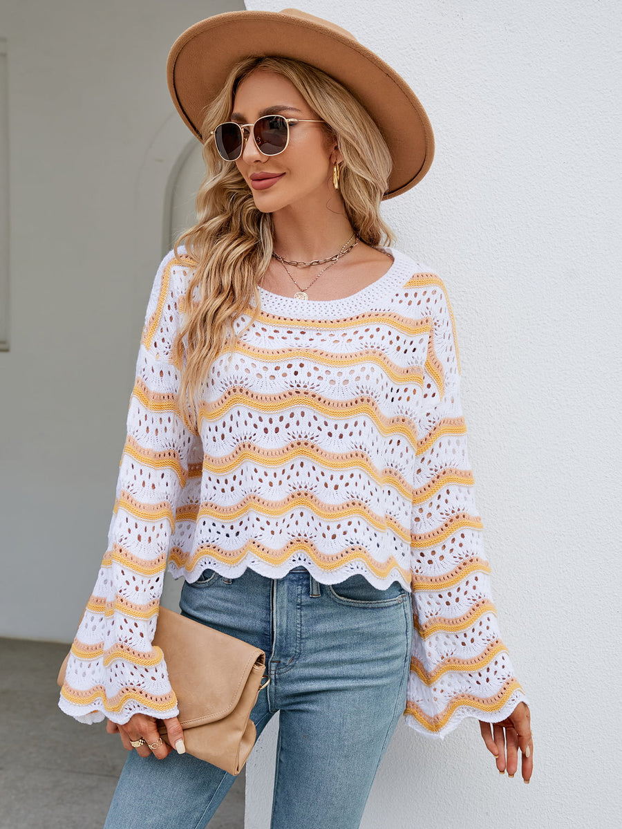 Scalloped crochet crop sweater in white with yellow and orange stripes, featuring bell sleeves.