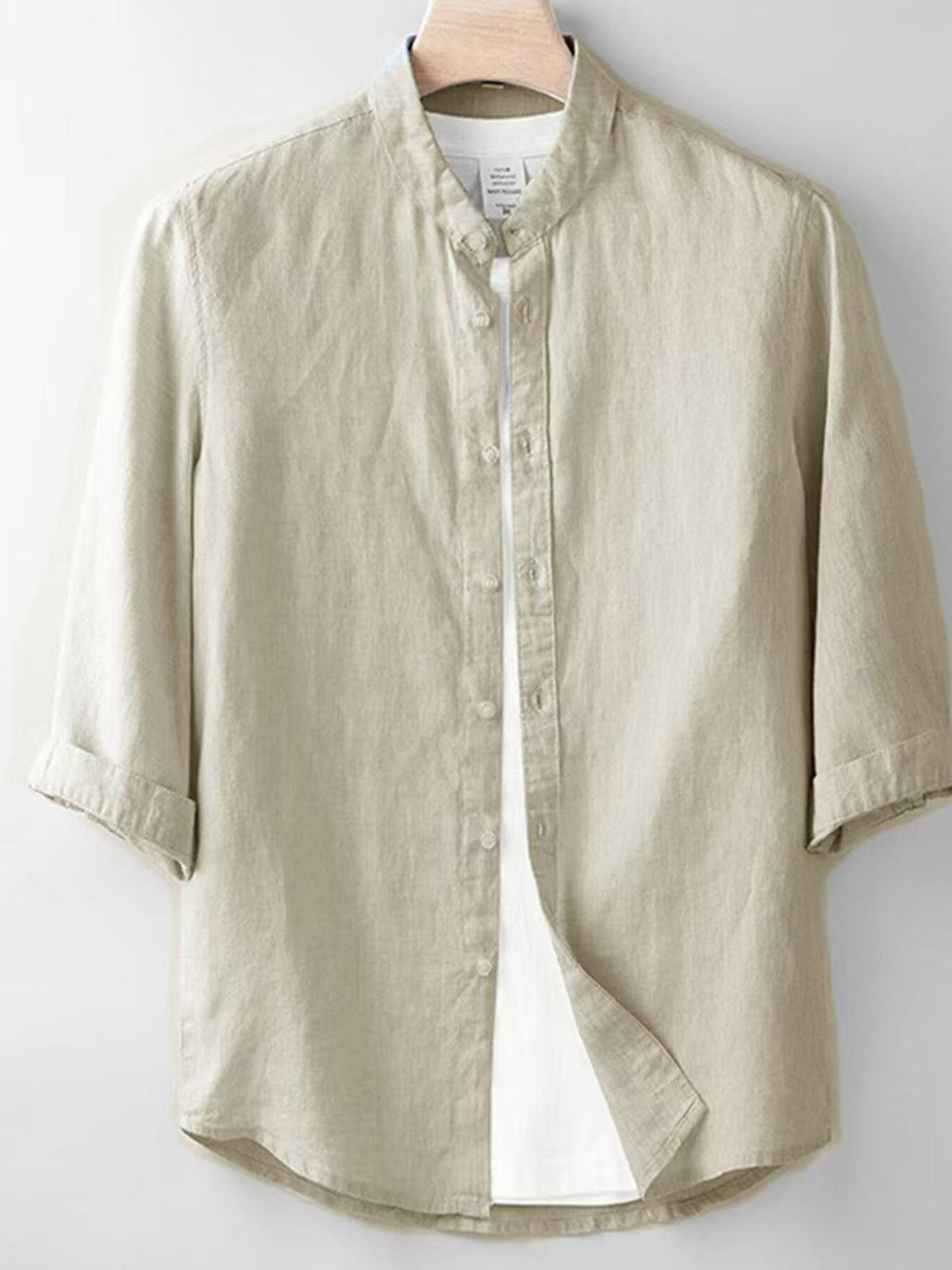 Linen band collar shirt in beige with 3/4 sleeves and button front.