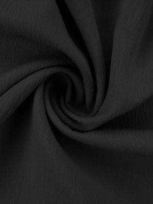 Black polyester pajama fabric with ruffled texture detail