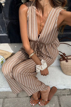 Chic striped two-piece set in camel with peplum hem and wide leg pants.