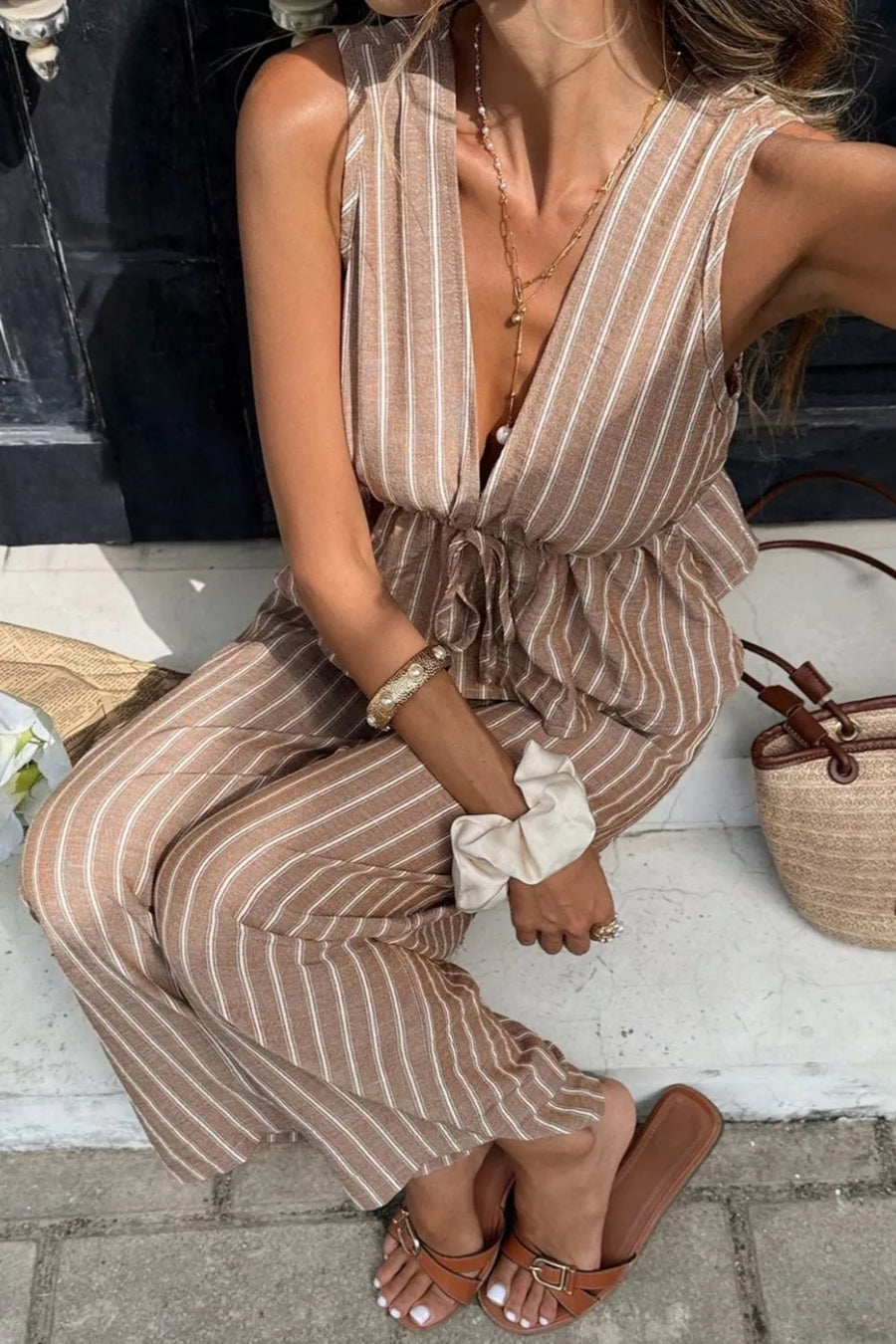 Chic striped two-piece set in camel with peplum hem and wide leg pants.