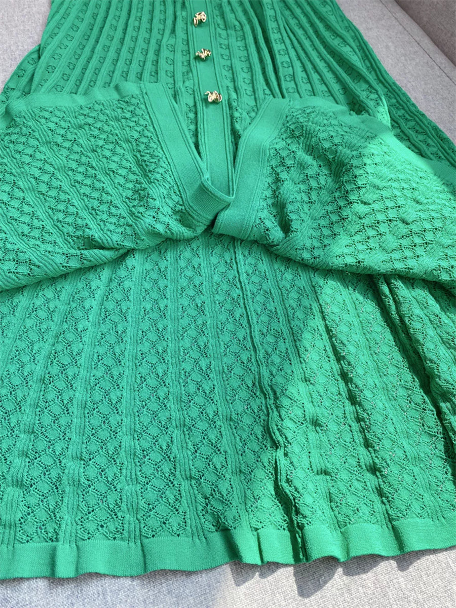 Green knit dress with Peter Pan collar and gold buttons, featuring a diamond pattern.