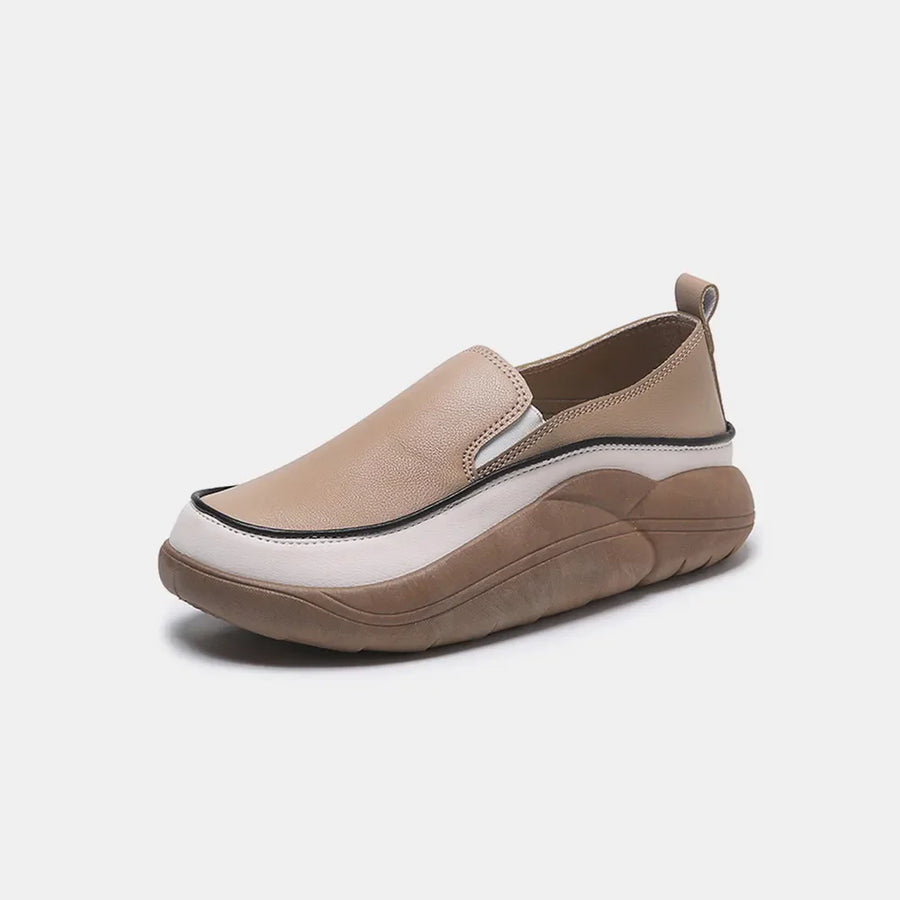 Khaki slip-on platform sneakers with a white and brown layered sole.