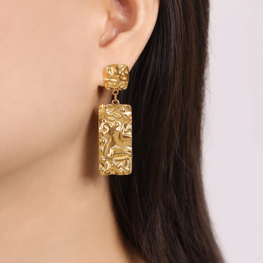 Gold crinkle drop earrings with textured rectangular pendants.