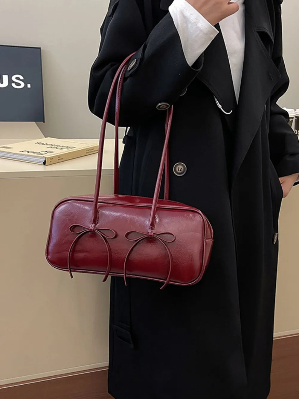 Burgundy patent leather shoulder bag with bow details