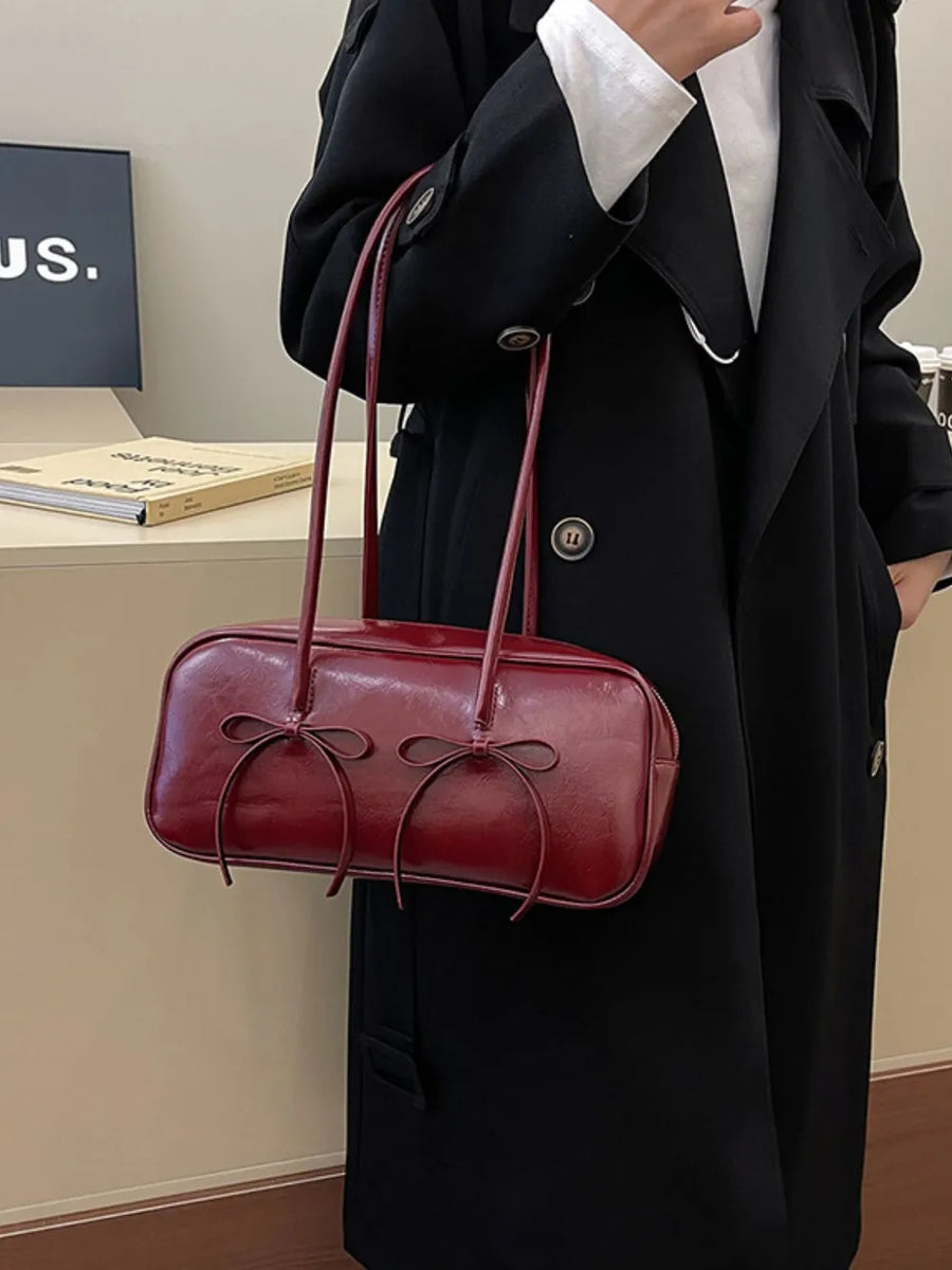 Burgundy patent leather shoulder bag with bow details