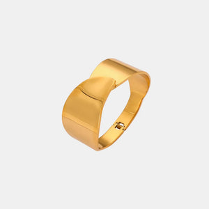 Sculpted gold leaf bracelet with a hinged clasp and polished finish.