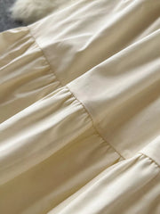 Apricot tiered skirt with elastic waist and lace detail.