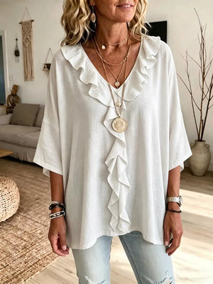 blouse in white featuring frill and relaxed fit