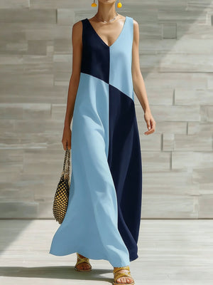 Geometric v-neck maxi dress in light blue and navy with a colorblock pattern.