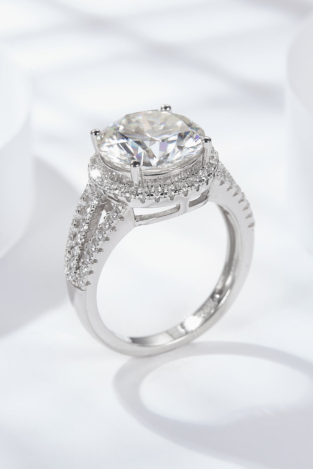 Silver split shank halo engagement ring with pave band
