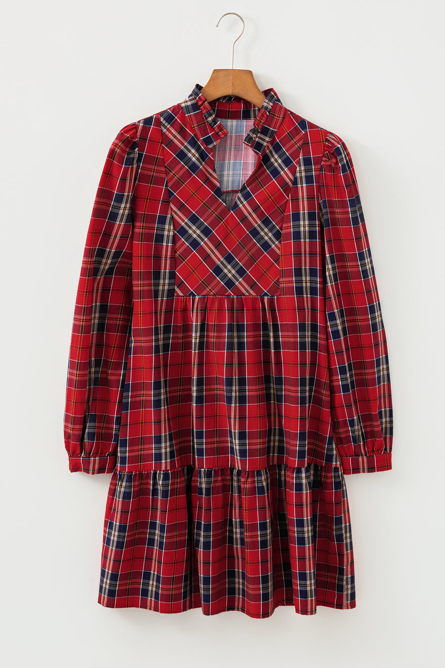 Red tartan mini dress with frilly collar, V-neck, and tiered skirt.
