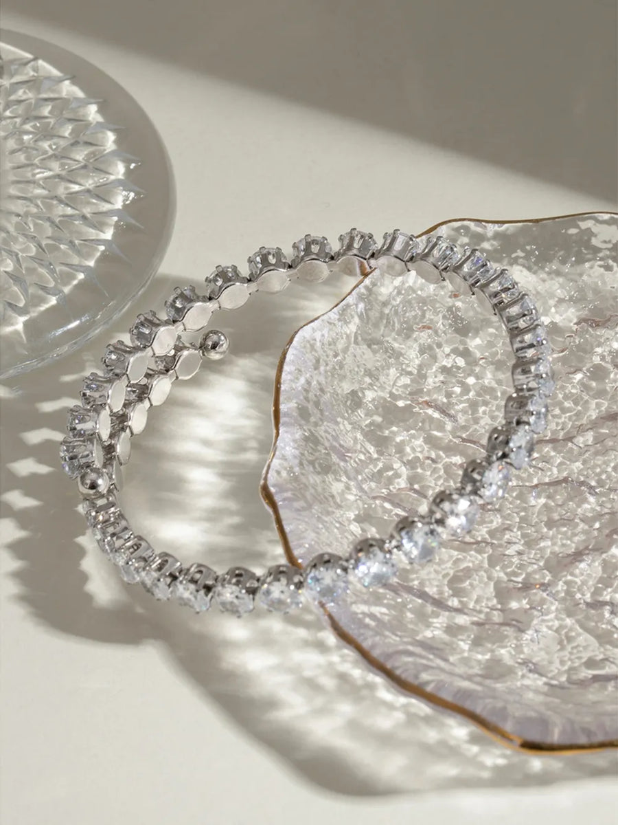 Silver double row pavé bangle bracelet with clear stones.