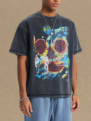 Black acid wash graphic t-shirt with a colorful abstract skull print and crew neck.
