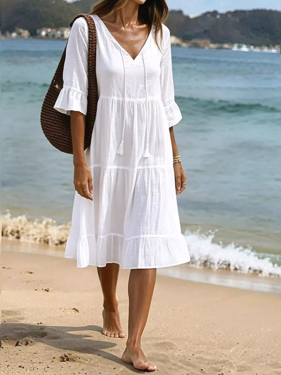 midi dress in white featuring tied neck and A-line fit