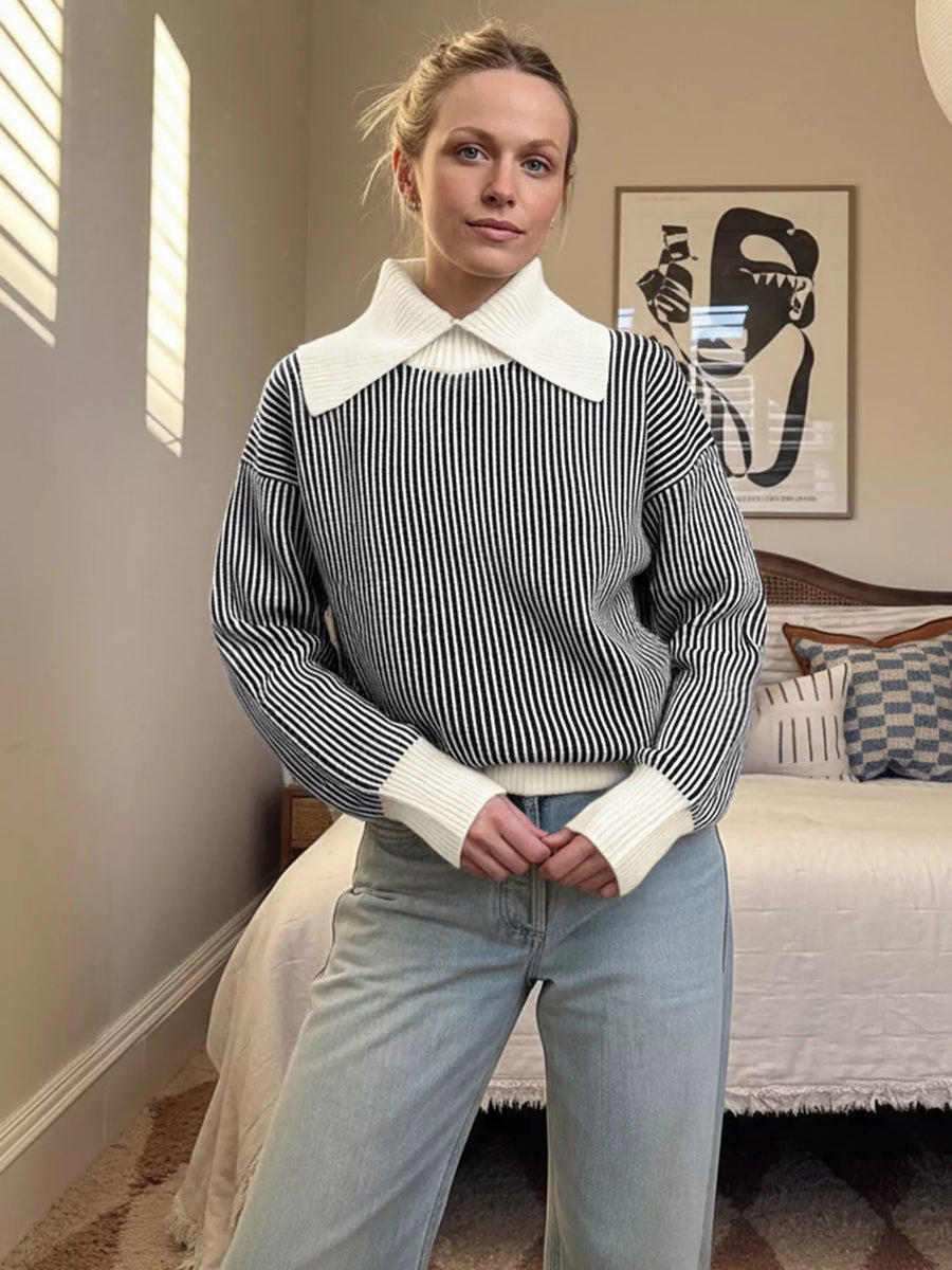 Black and white striped knit sweater with a contrast white collar and cuffs.
