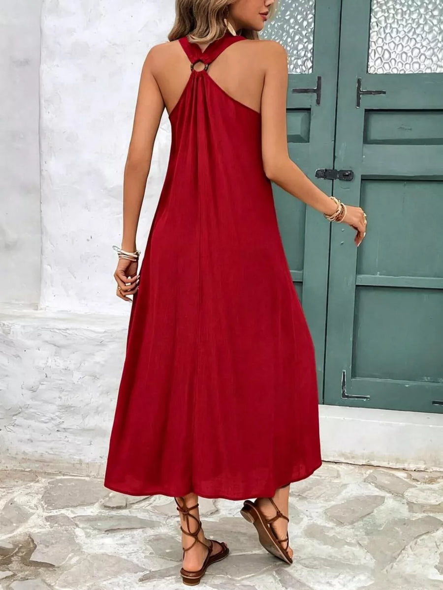 Red halter-detail midi dress with a flowing A-line cut and ring detail at the neckline.