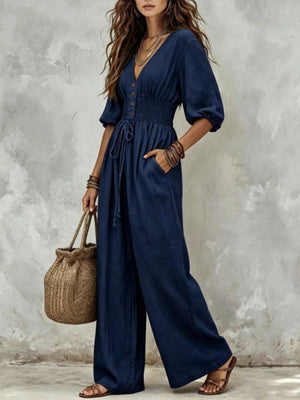 100% polyester Care instructions: Machine wash cold jumpsuit in Black with wide-leg silhouette