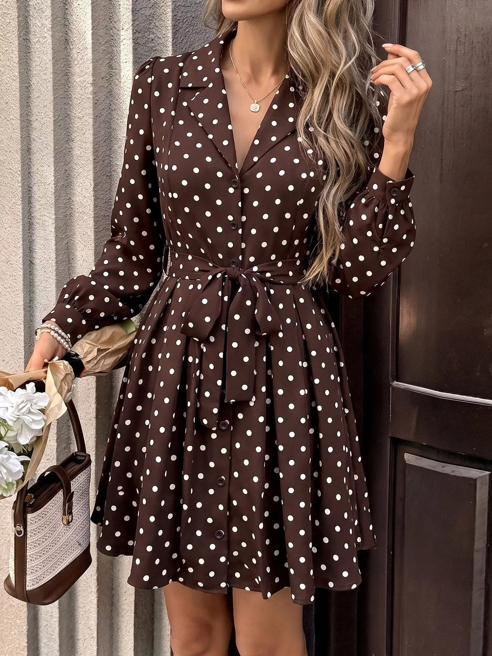 white shirt dress featuring buttoned and polka dot