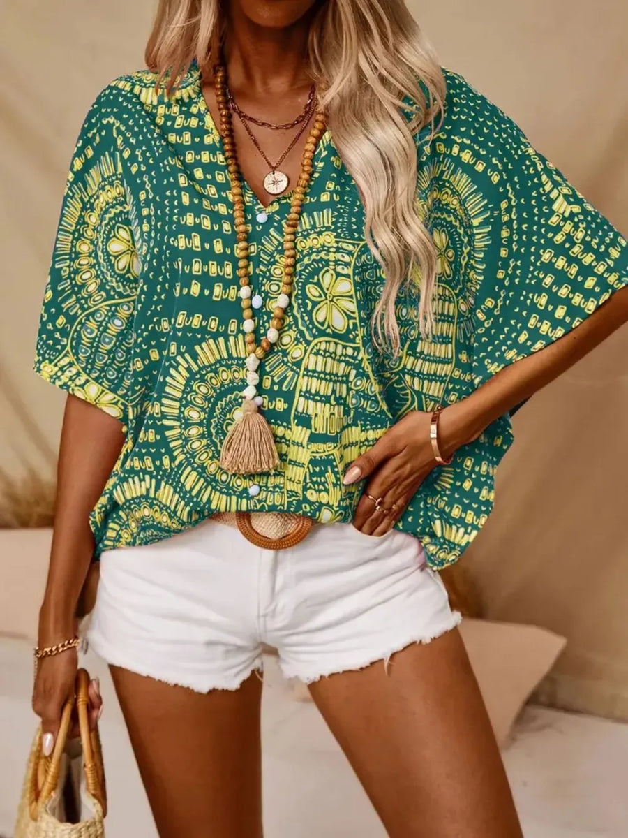 Bohemian print green v-neck t-shirt with short sleeves and a relaxed fit.