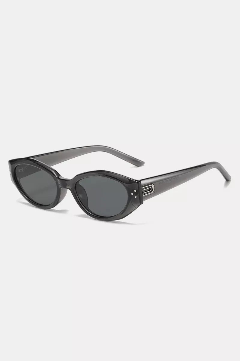 Black cat-eye sunglasses with metallic accents and decorative studs
