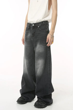 Oversized wash denim jeans in charcoal grey with a baggy fit.