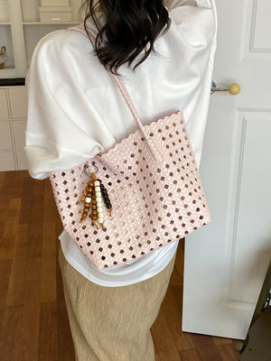 handbag in Pink with geometric and woven design