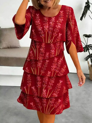 Red floral tiered ruffle hem dress with split sleeves and above-knee length.