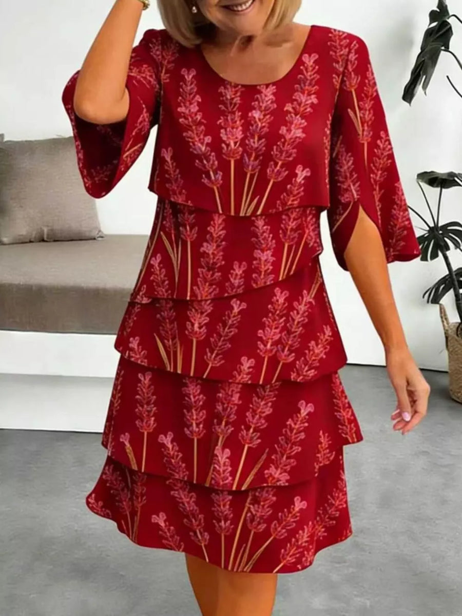 Red floral tiered ruffle hem dress with split sleeves and above-knee length.